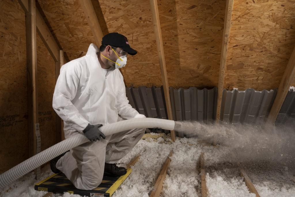 Man Blowing TAP® Insulation